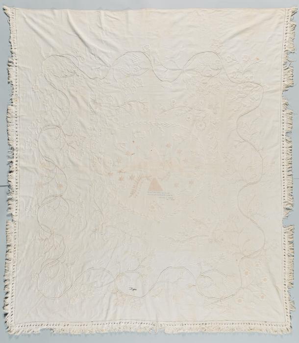 Whitework coverlet with wavy pattern and fringe border