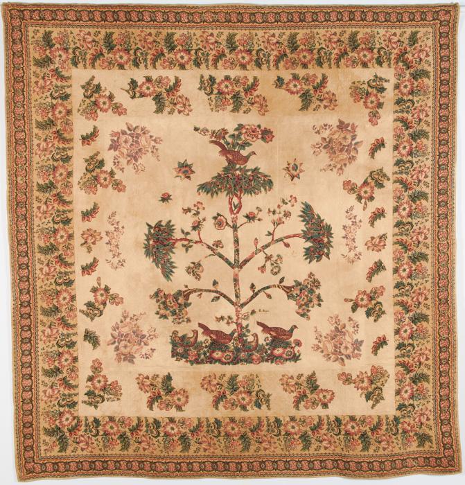 Chintz quilt with appliqued floral designs on border and central design of a large tree with bird at the top.